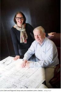 John Clark and JoAnn Daniels looking over some blueprints