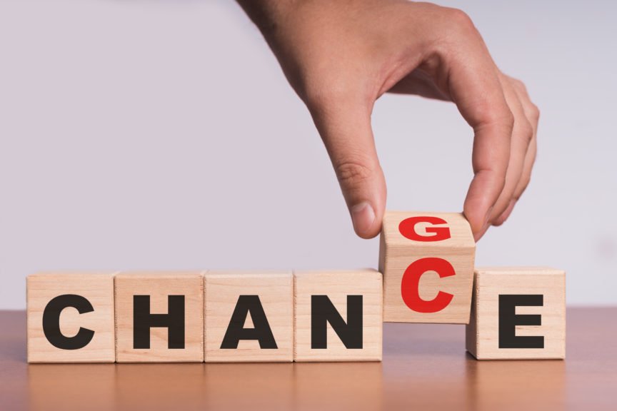 Hand Changing the Spelling of Block from Change to Chance